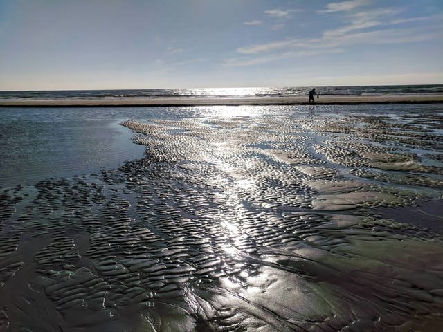 the tides receeded revealing a sandbar